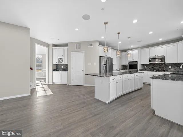 a view of a hallway with windows