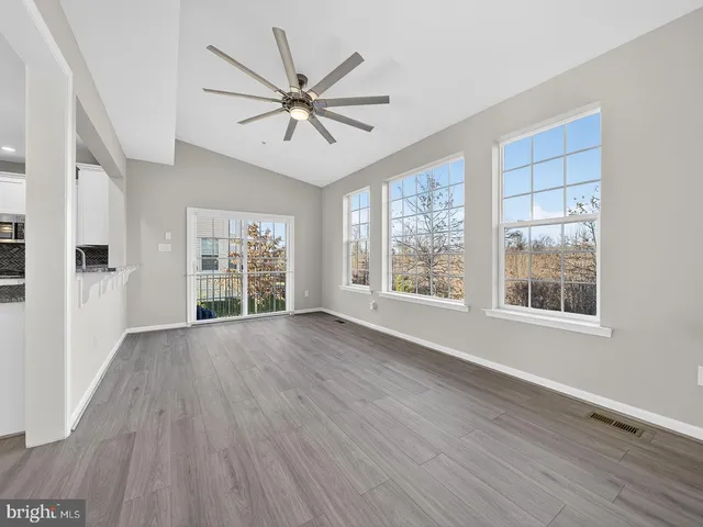 a view of staircase with wooden floor and stairs
