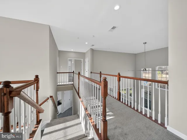 a bathroom with a granite countertop sink mirror and double