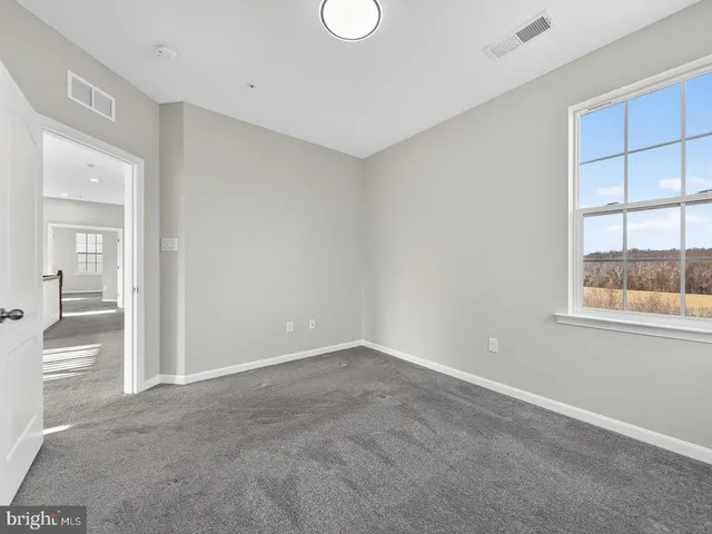 a view of a big house with a yard