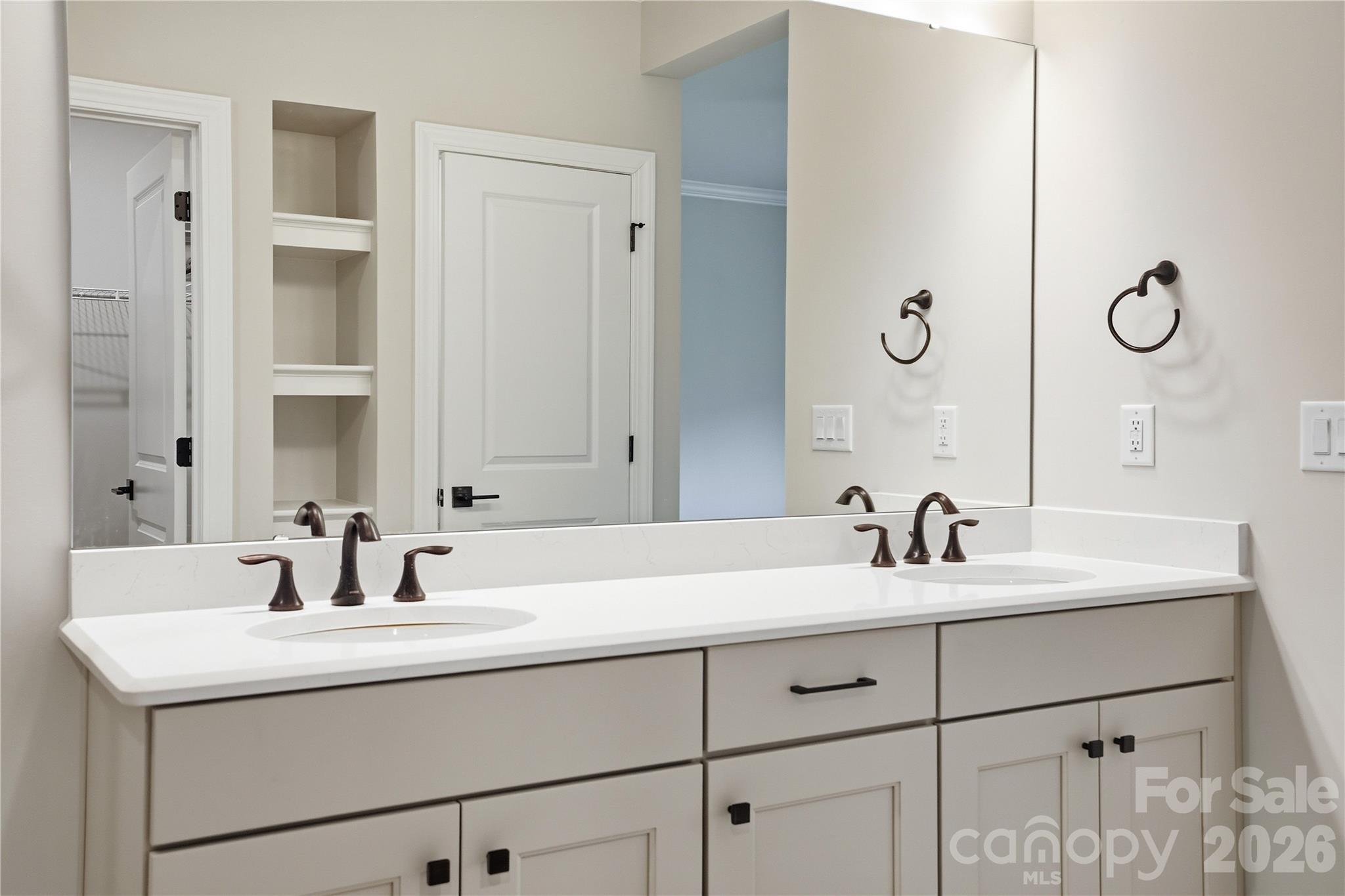 5562 Caneel Lane Denver, NC 28037 - Photo 23 of 44 a bathroom with a sink and a mirror