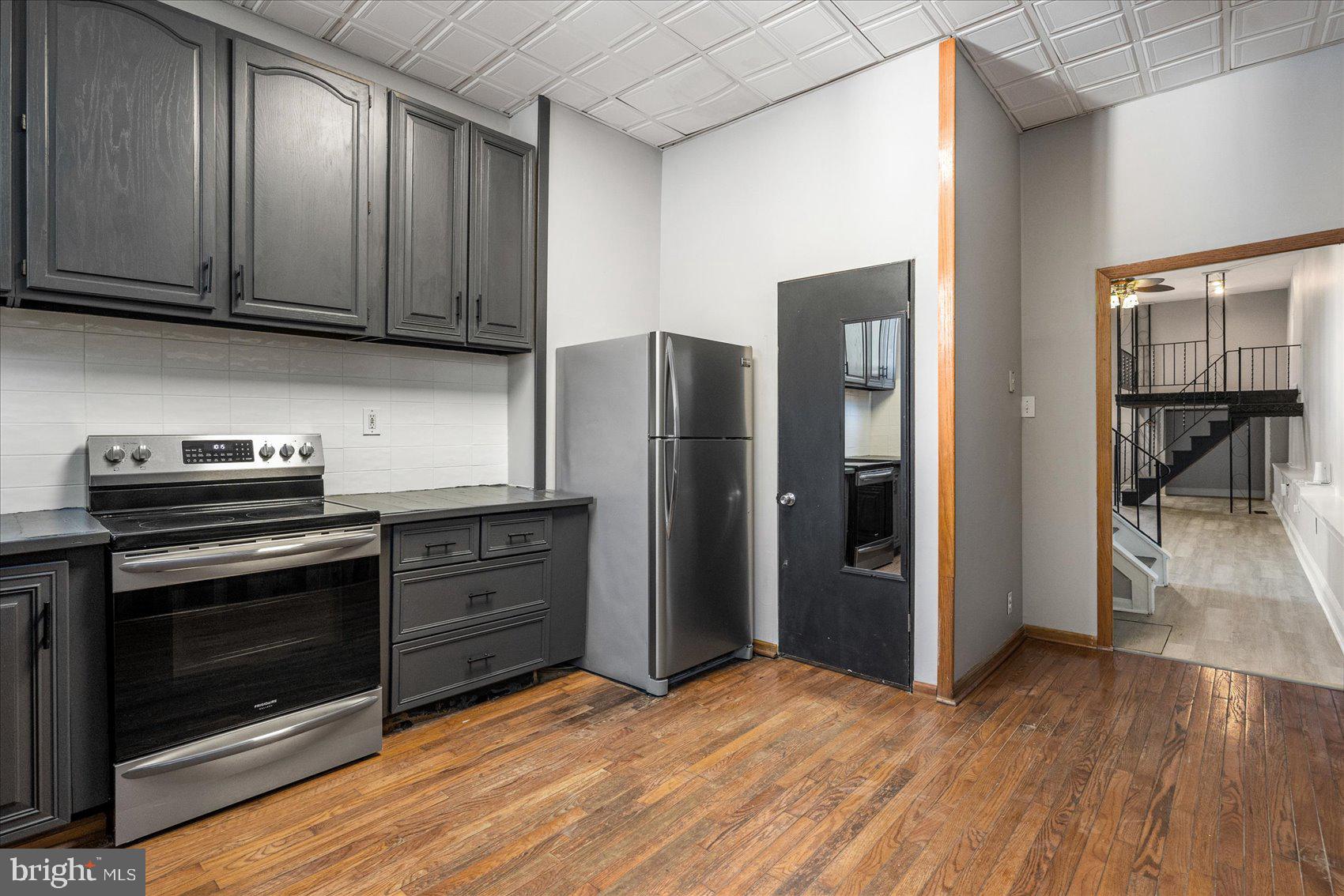 3526 Old York Road Baltimore, MD 21218 - Photo 11 of 33 a kitchen with stainless steel appliances granite countertop a refrigerator stove and cabinets