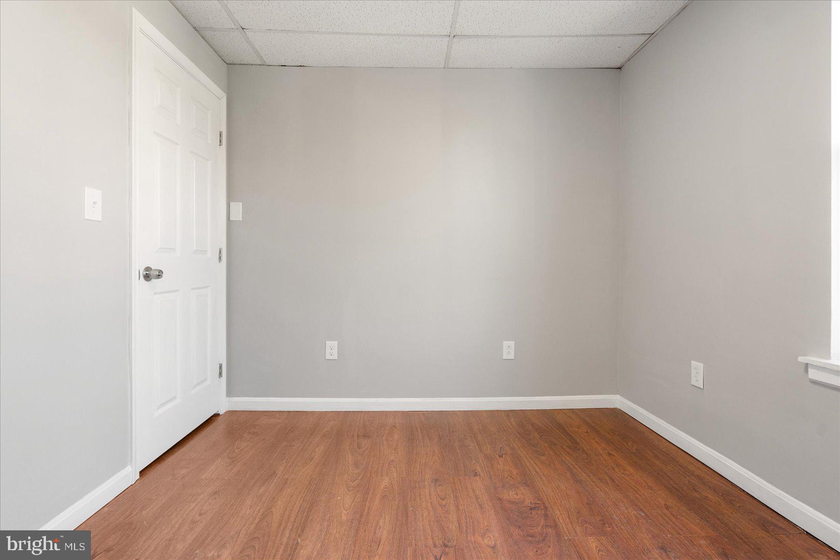 3526 Old York Road Baltimore, MD 21218 - Photo 21 of 33 a view of an empty room with wooden floor