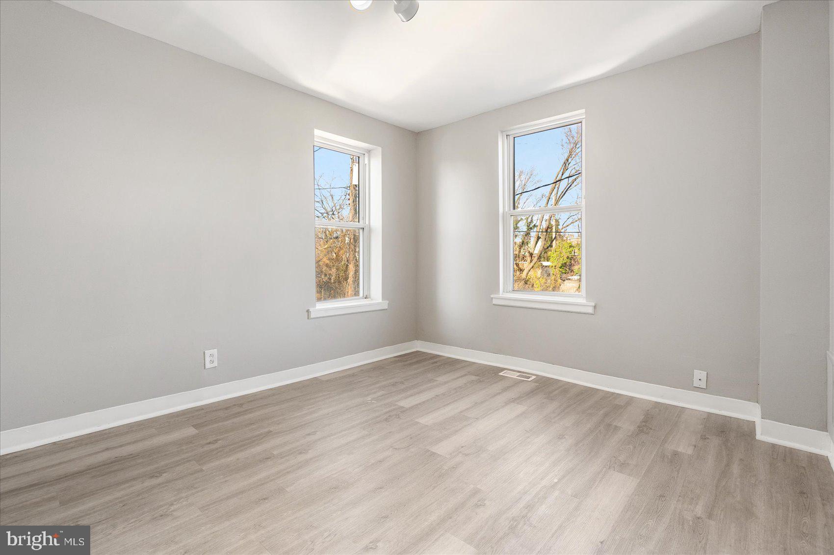 3526 Old York Road Baltimore, MD 21218 - Photo 22 of 33 an empty room with windows and closet