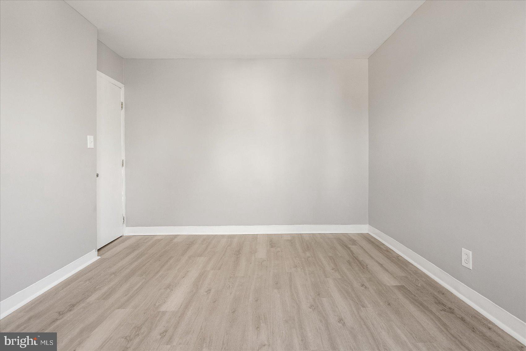 3526 Old York Road Baltimore, MD 21218 - Photo 23 of 33 a view of an empty room with wooden floor