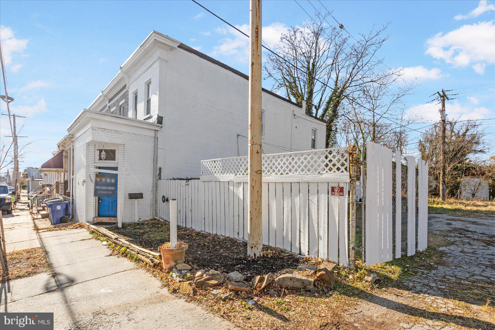 3526 Old York Road Baltimore, MD 21218 - Photo 3 of 33 a front view of a house with a yard