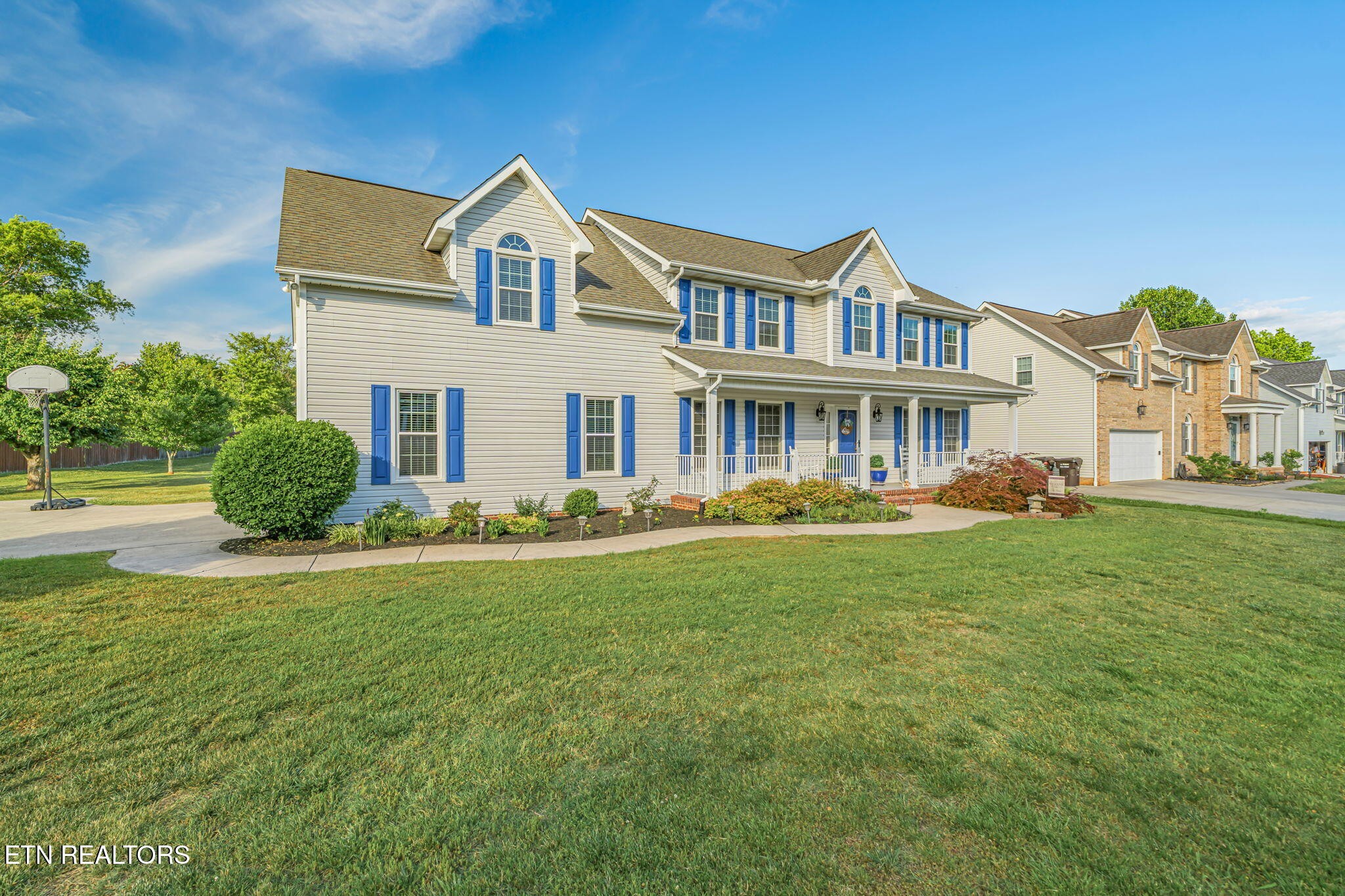 7030 Westerly Winds Road Knoxville, TN 37931 - Photo 6 of 40 a front view of a house with a garden