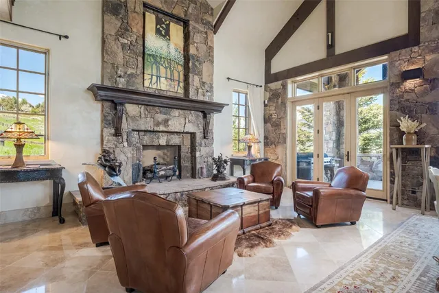 a kitchen with granite countertop kitchen island a sink a counter and a window