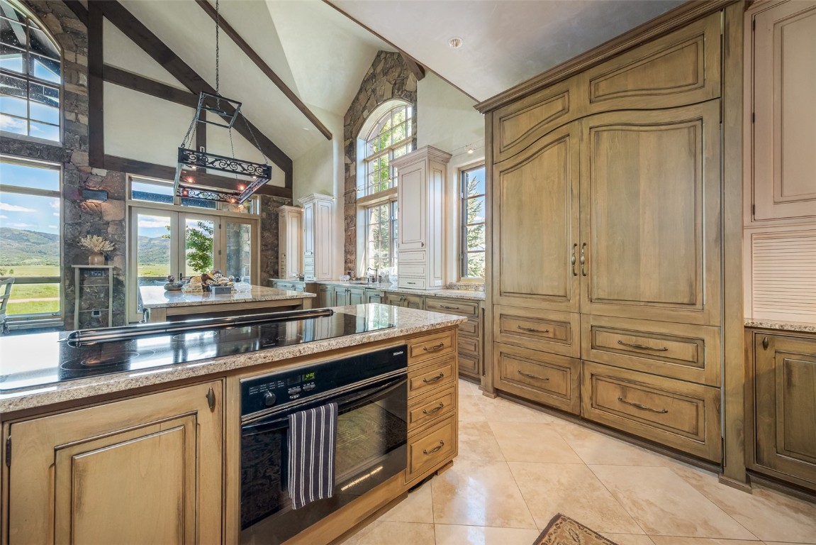30855 Emerald Ridge Steamboat Springs, CO 80487 - Photo 15 of 50 a kitchen with granite countertop a sink and a wooden floors
