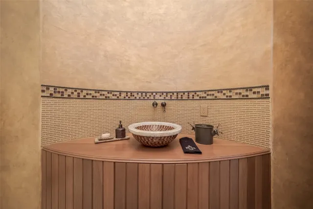 a bedroom with a bed tv and a window