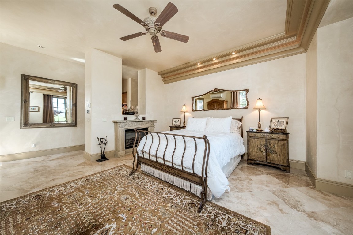 30855 Emerald Ridge Steamboat Springs, CO 80487 - Photo 22 of 50 a bedroom with a bed and a chandelier