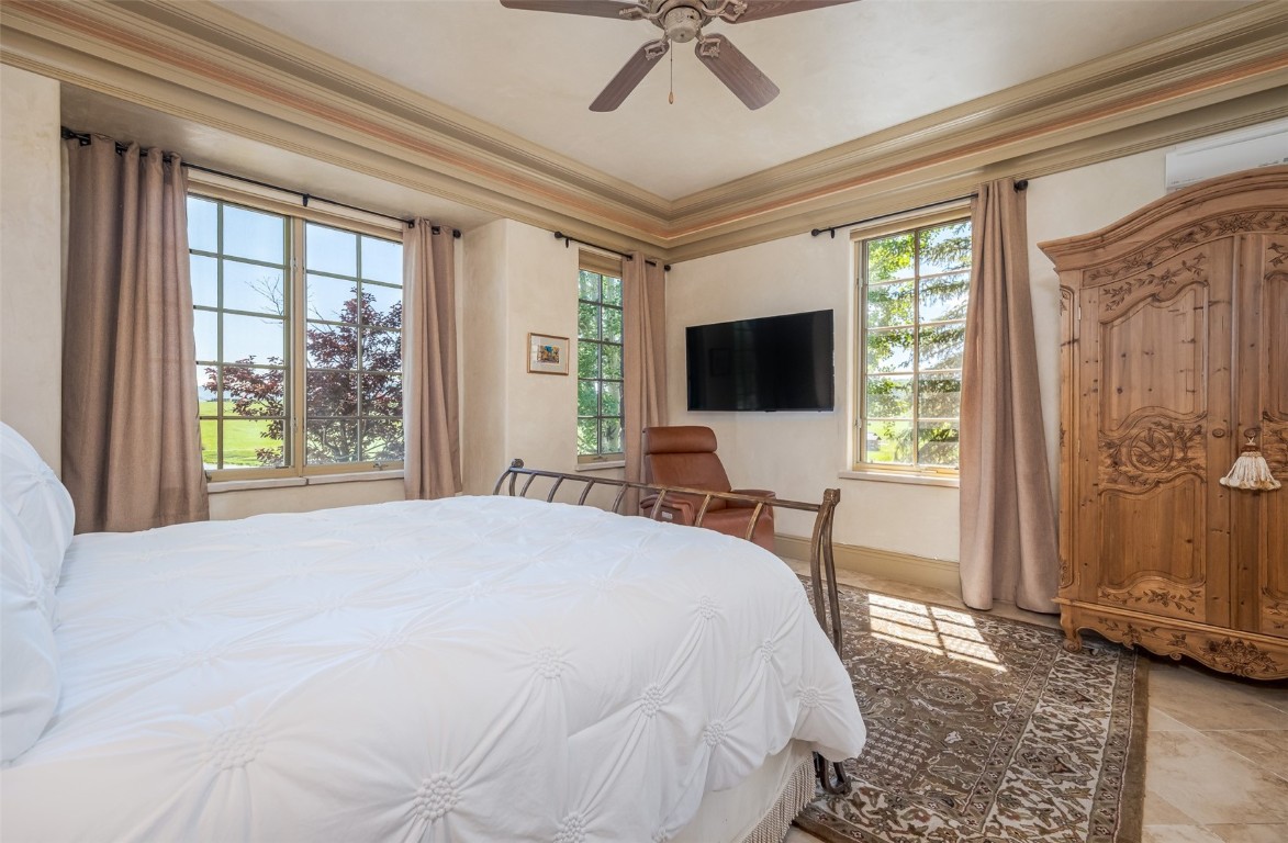 30855 Emerald Ridge Steamboat Springs, CO 80487 - Photo 23 of 50 a bedroom with a bed tv and a window