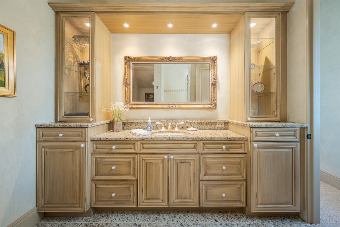 30855 Emerald Ridge Steamboat Springs, CO 80487 - Photo 40 of 50 a bathroom with a granite countertop sink a mirror and a