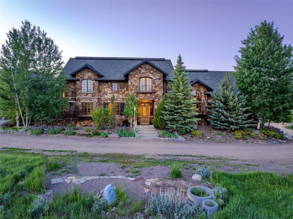 30855 Emerald Ridge Steamboat Springs, CO 80487 - Photo 45 of 50 a front view of a house with garden