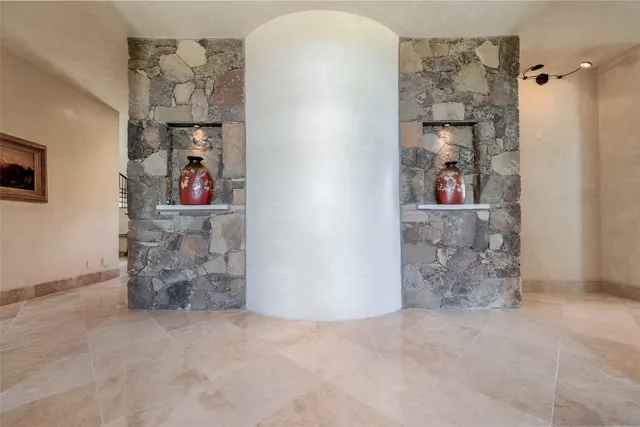 an empty room with shelves