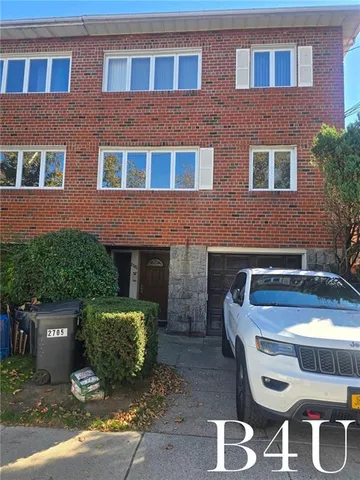 a front view of a house with parking space