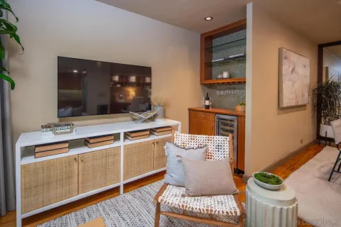 a living room with furniture fireplace and flat screen tv