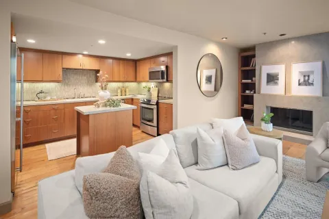 a kitchen with a sink a stove a microwave and cabinets