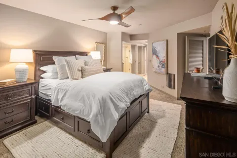 a bathroom with a double vanity sink mirror and shower
