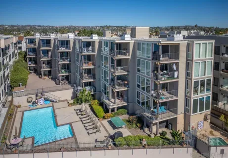a view of swimming pool with outdoor seating and plants