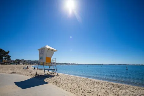 a view of swimming pool with outdoor seating yard and lake view