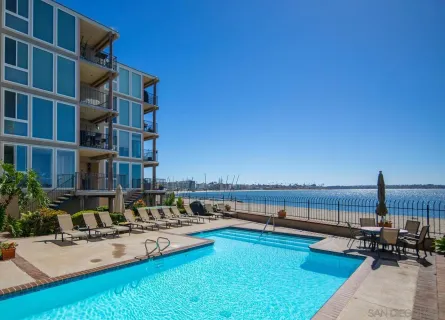 a front view of multiple houses with yard