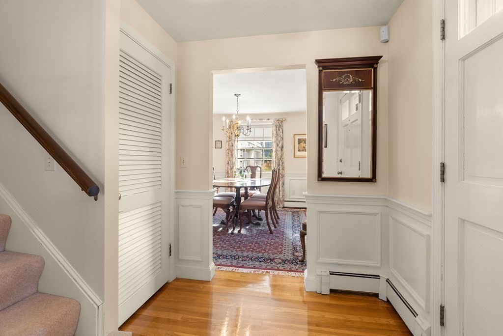 197 Bristol Road Wellesley, MA 02481 - Photo 4 of 27 a view of a hallway with dining room and wooden floor