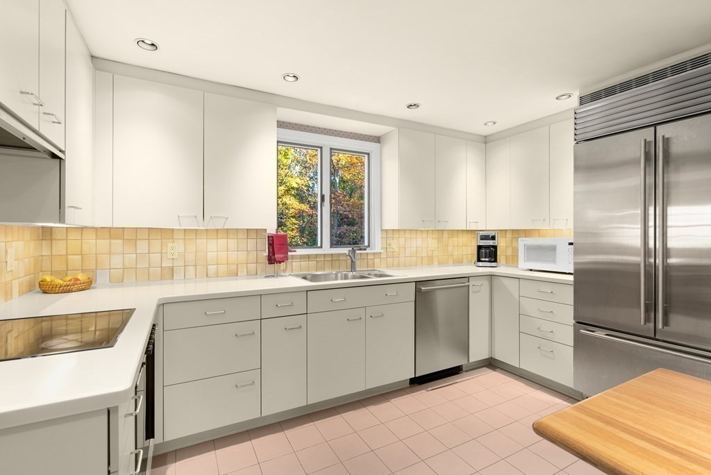 197 Bristol Road Wellesley, MA 02481 - Photo 8 of 27 a kitchen with a sink and refrigerator