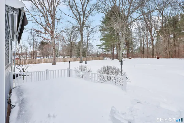 a kitchen with refrigerator a microwave a stove and cabinets