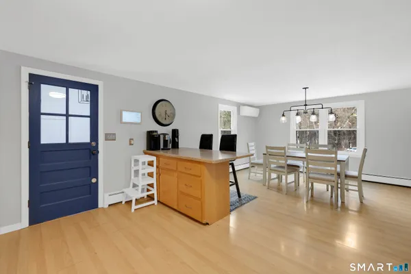 a kitchen with white cabinets and sink