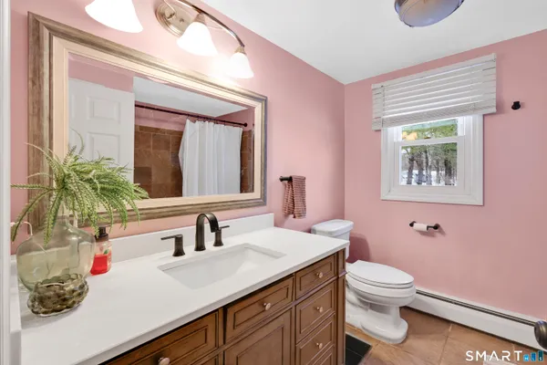 a bed room with a bed and a book shelf