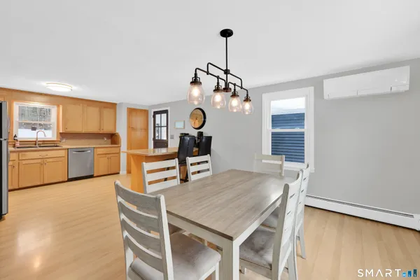 a view of a dining room with furniture window and wooden floor