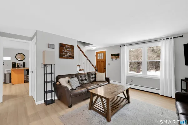 a living room with furniture and a window