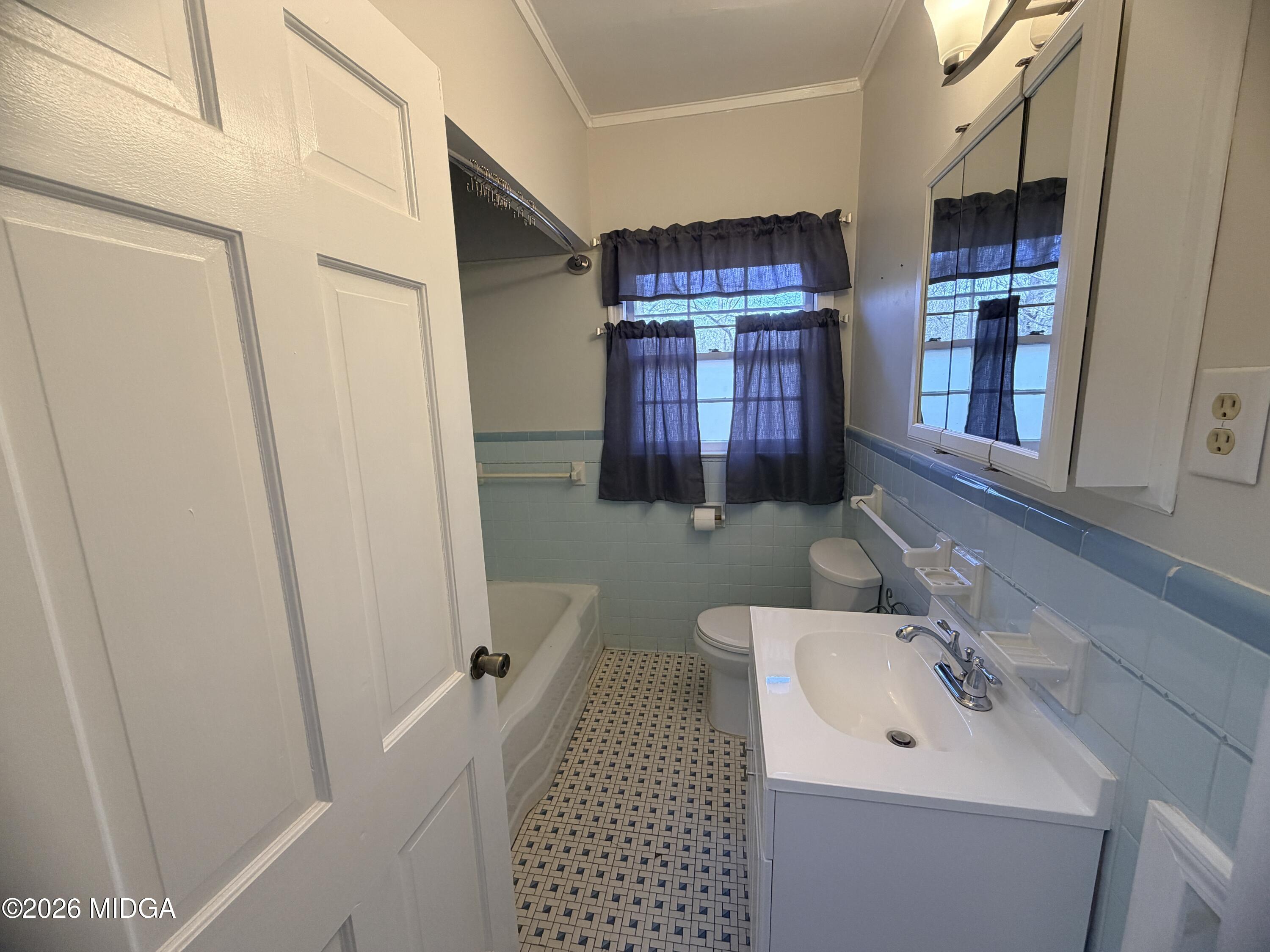 419 West Johnston Street Forsyth, GA 31029 - Photo 21 of 34 a bathroom with a sink and a mirror