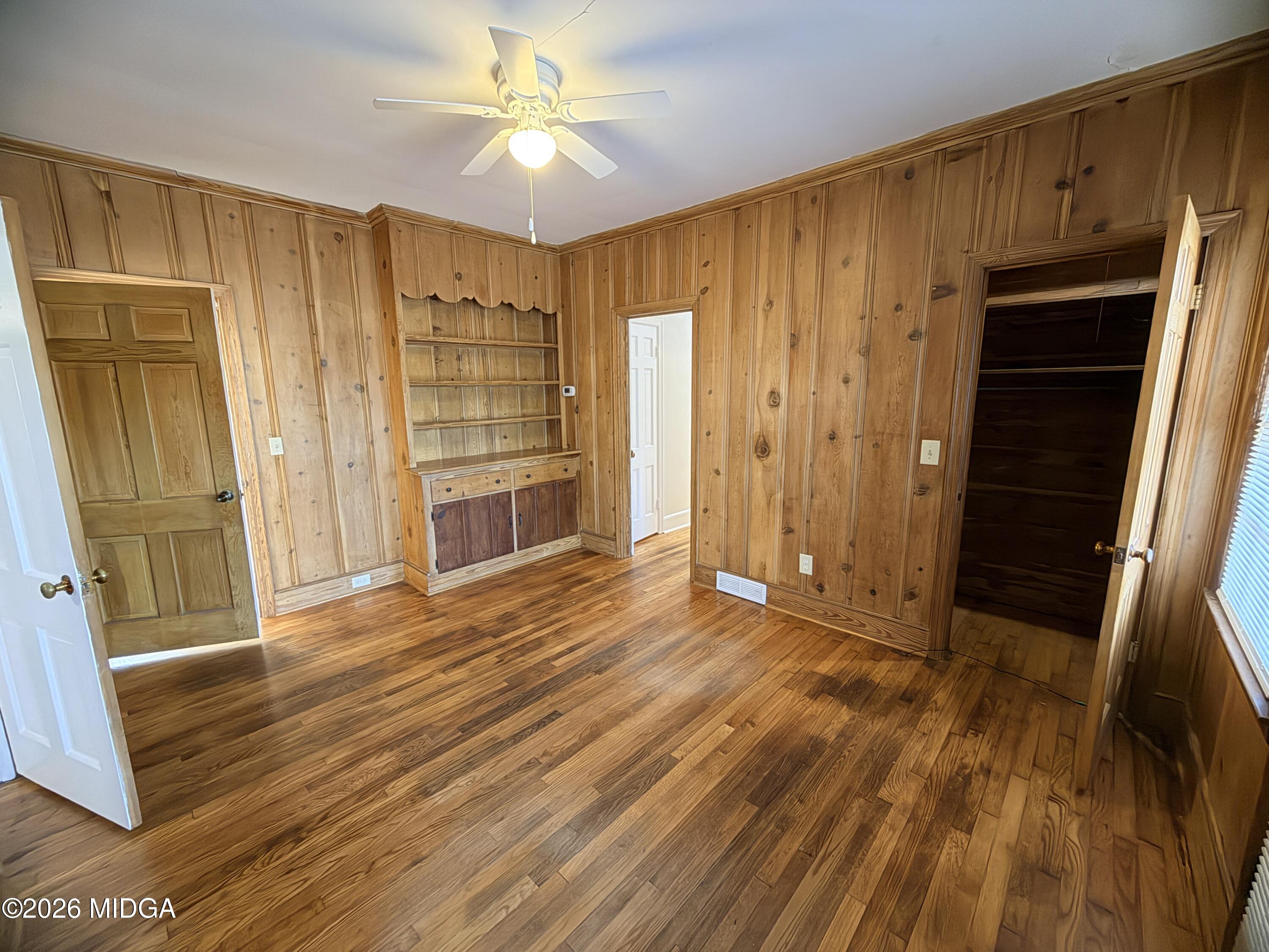 419 West Johnston Street Forsyth, GA 31029 - Photo 23 of 34 an empty room with wooden floor closet and entryway