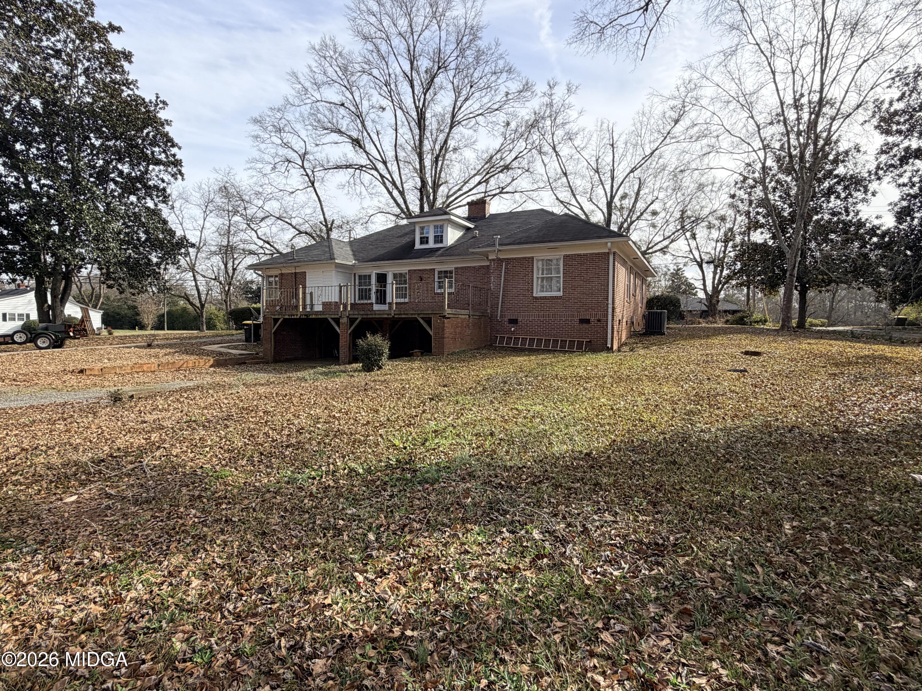 419 West Johnston Street Forsyth, GA 31029 - Photo 29 of 34 a view of a yard with a house