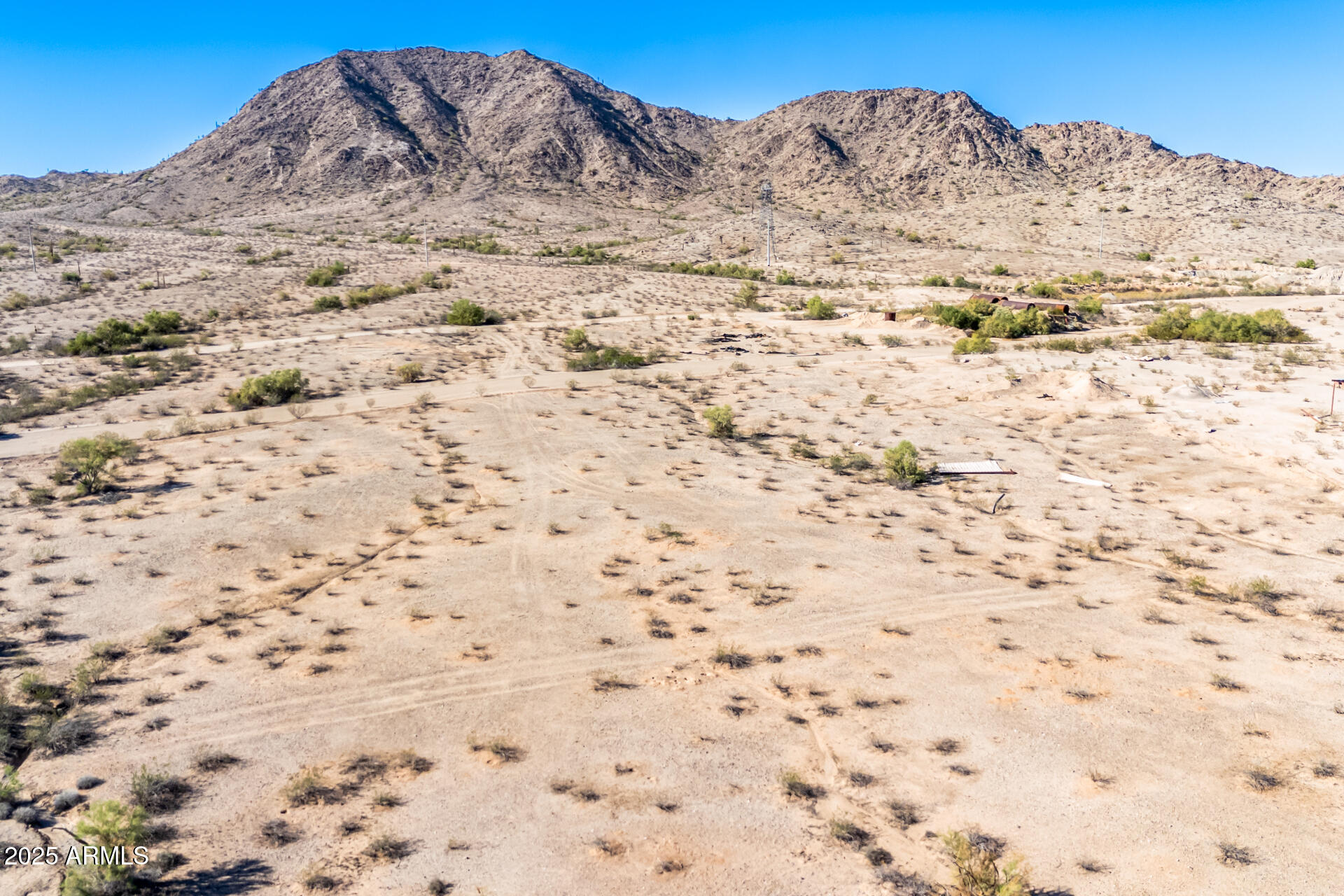 0 South 3rd Street, Unit 3 Buckeye, AZ 85326 - Photo 6 of 15 a view of a dry yard with mountains in the background