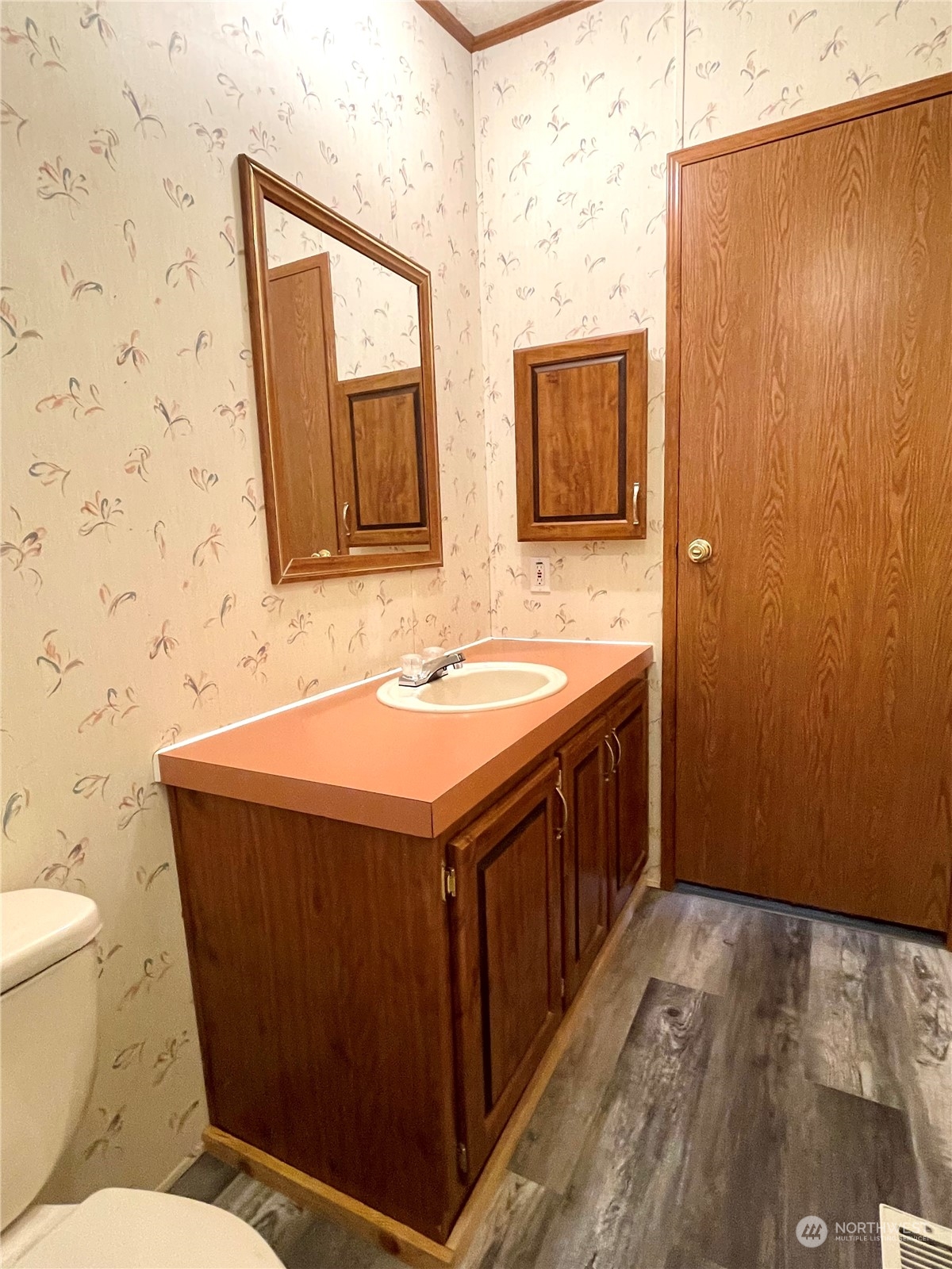 813 Conconully Road Okanogan, WA 98840 - Photo 18 of 40 a bathroom with a sink a toilet and mirror
