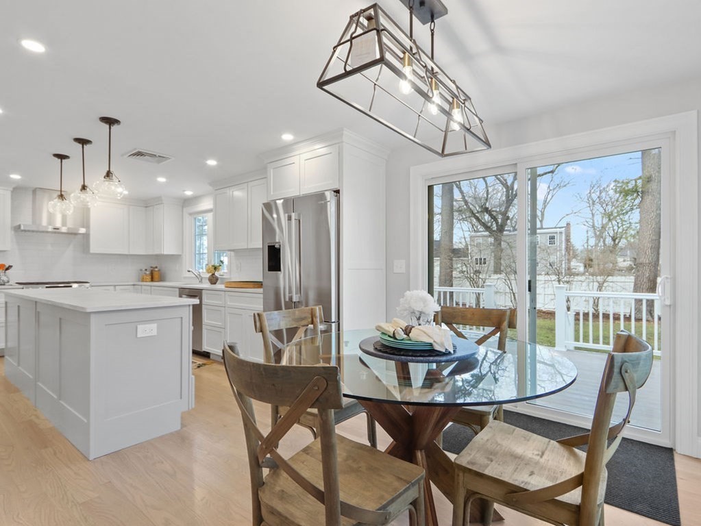 19 Crest Road Natick, MA 01760 - Photo 11 of 40 a dining room with furniture a chandelier and kitchen view