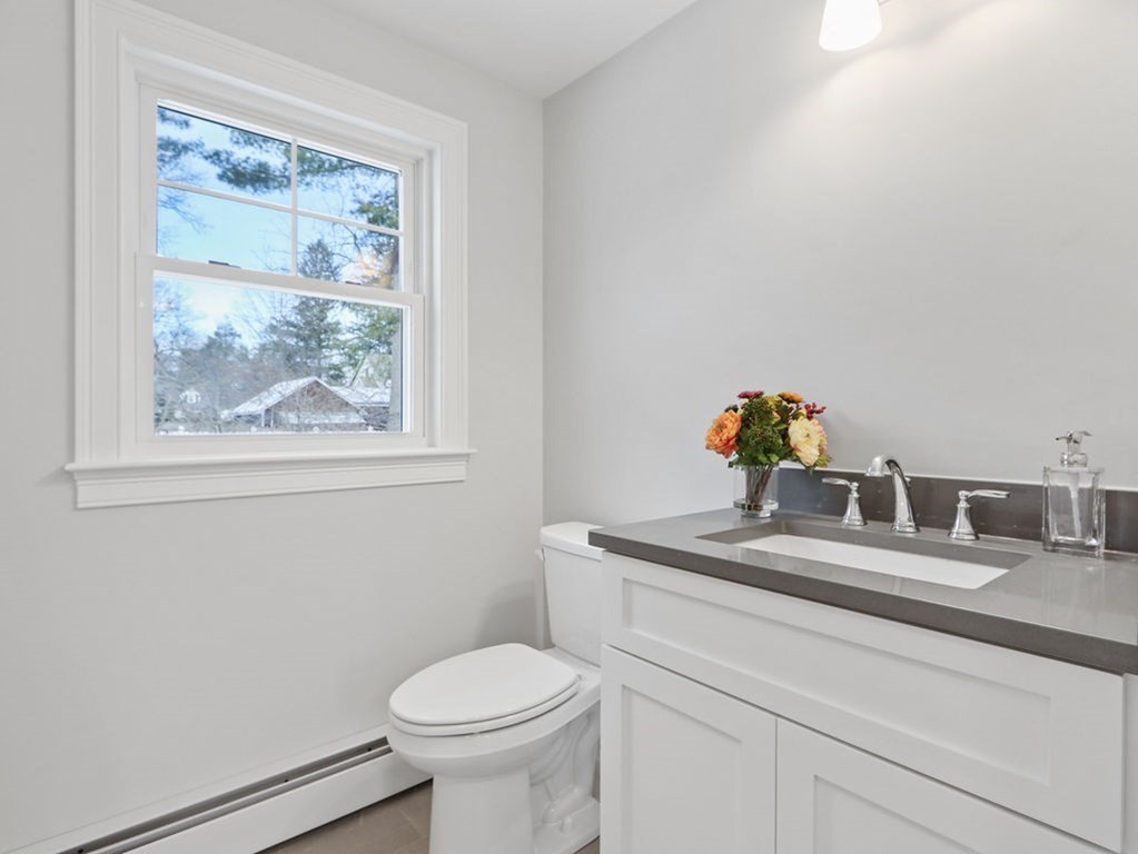 19 Crest Road Natick, MA 01760 - Photo 15 of 40 a bathroom with a toilet sink and mirror