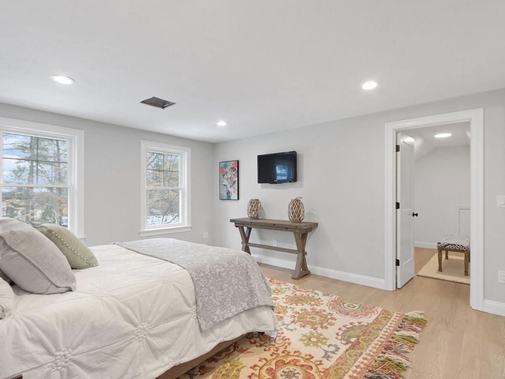 19 Crest Road Natick, MA 01760 - Photo 18 of 40 a spacious bedroom with a bed and a desk