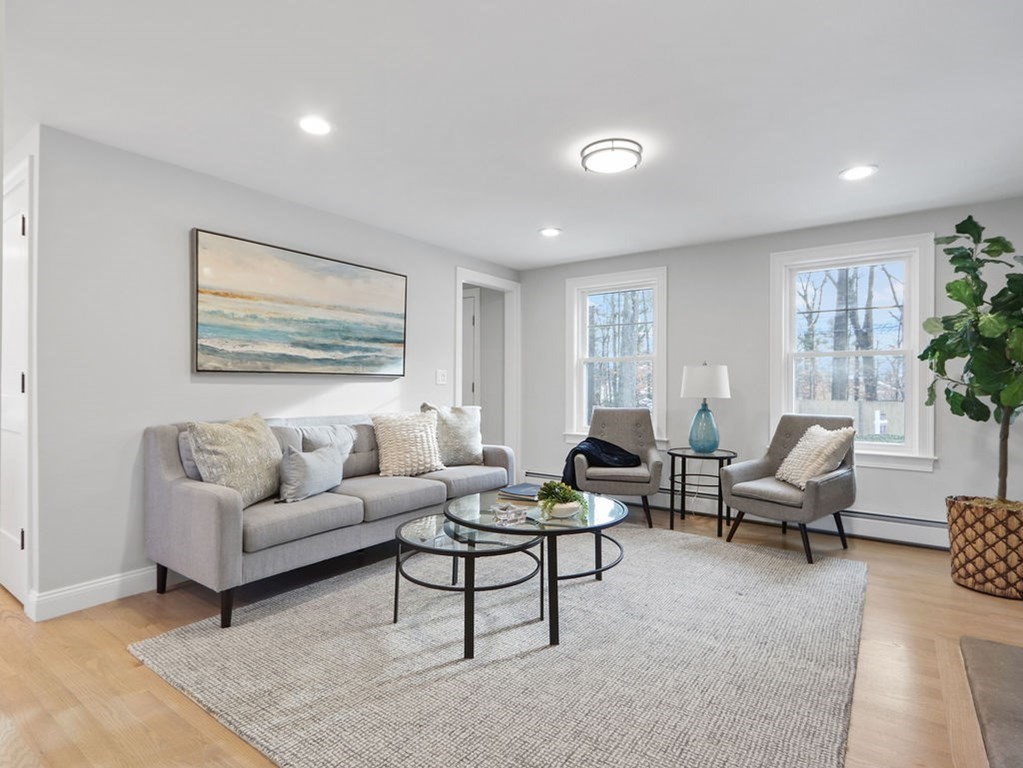 19 Crest Road Natick, MA 01760 - Photo 2 of 40 a living room with furniture and a large window