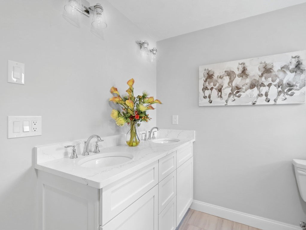 19 Crest Road Natick, MA 01760 - Photo 25 of 40 a bathroom with a sink a vanity and a mirror