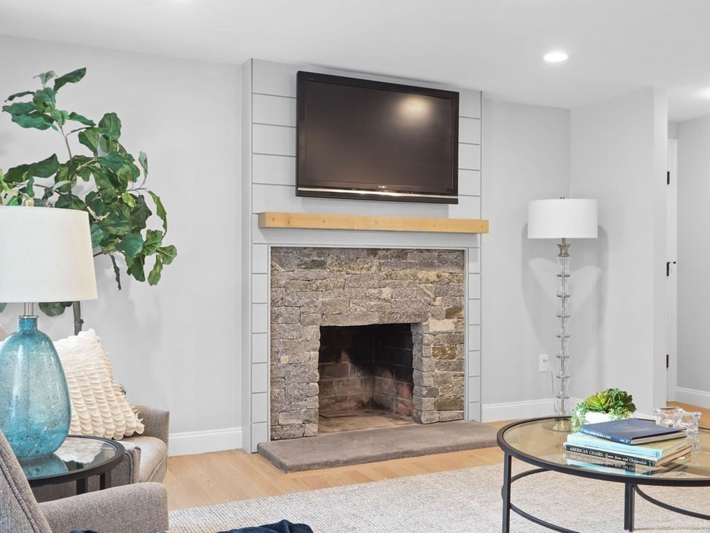 19 Crest Road Natick, MA 01760 - Photo 3 of 40 a living room with furniture and a fireplace