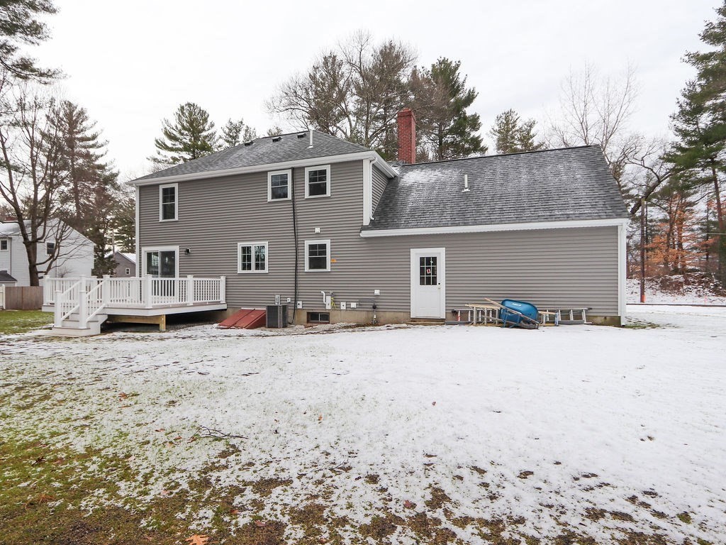 19 Crest Road Natick, MA 01760 - Photo 36 of 40 a view of a house with a yard covered in snow