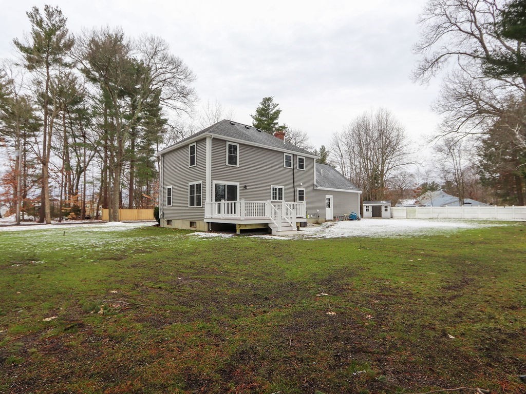 19 Crest Road Natick, MA 01760 - Photo 38 of 40 a view of a white house in front of a big yard with large trees