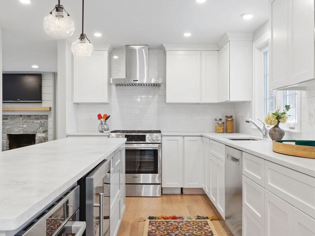 19 Crest Road Natick, MA 01760 - Photo 9 of 40 a kitchen with a sink a stove and cabinets