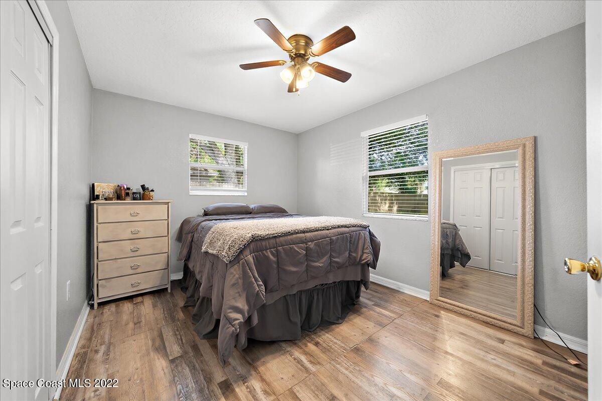 6165 Corning Road Cocoa, FL 32927 - Photo 20 of 44 a bedroom with a bed and a view of room