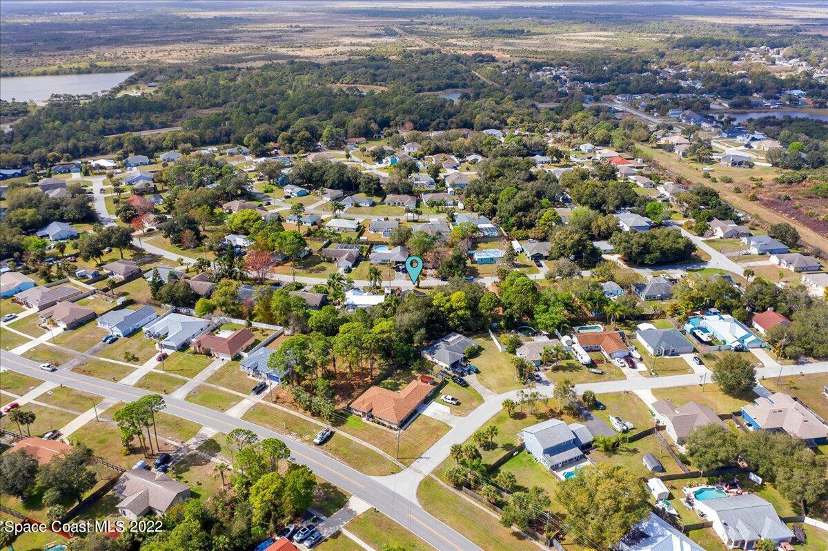 6165 Corning Road Cocoa, FL 32927 - Photo 2 of 44 an aerial view of residential houses with outdoor space