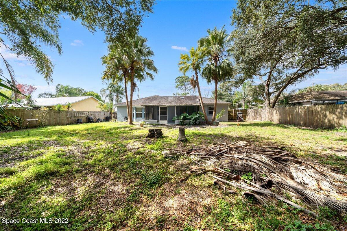 6165 Corning Road Cocoa, FL 32927 - Photo 28 of 44 a front view of a house with garden
